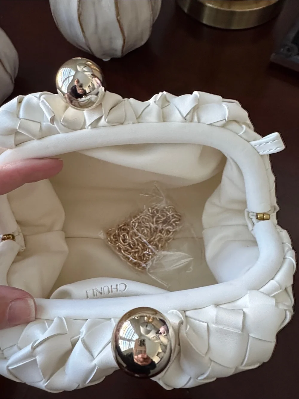 Elegant White Woven Clutch with Gold Accent
